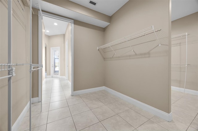 7303 Spring Mountain Ln, Yalaha, FL 34797 - spacious closet featuring light tile patterned flooring