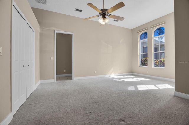 7303 Spring Mountain Ln, Yalaha, FL 34797 - unfurnished bedroom featuring carpet floors, a closet, and a ceiling fan