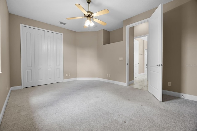 7303 Spring Mountain Ln, Yalaha, FL 34797 - unfurnished bedroom with carpet, a closet, and a ceiling fan