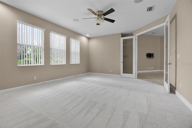 7303 Spring Mountain Ln, Yalaha, FL 34797 - unfurnished bedroom featuring carpet, french doors, and a ceiling fan