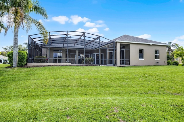 7303 Spring Mountain Ln, Yalaha, FL 34797 - back of house featuring a lawn, stucco siding, and glass enclosure
