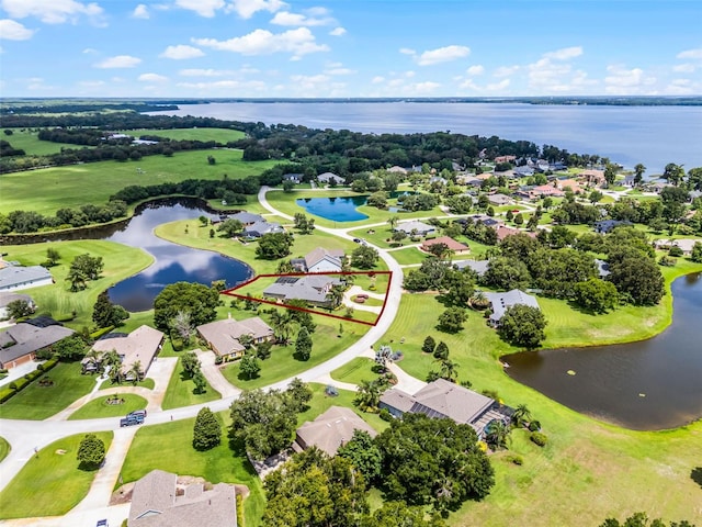 7303 Spring Mountain Ln, Yalaha, FL 34797 - aerial perspective of suburban area featuring a nearby body of water and a golf club