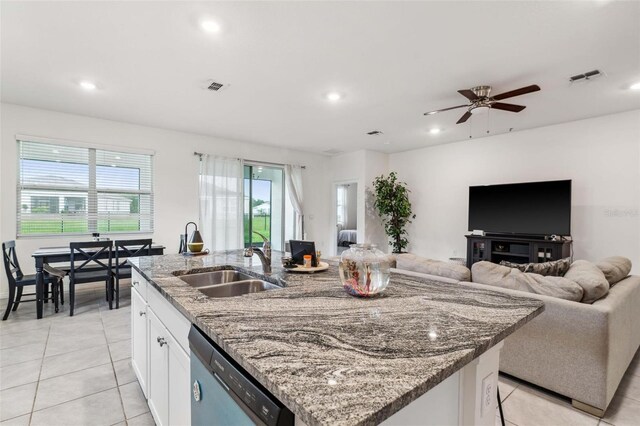4701 NW 51st Terrace Rd, Ocala, FL 34482 - kitchen featuring dishwasher, an island with sink, light tile patterned flooring, white cabinets, and recessed lighting