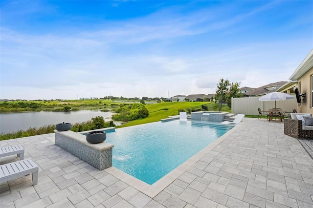 3304 Canna Lily Pl, Clermont, FL 34711 - view of swimming pool with a patio area, a pool with connected hot tub, and a water view