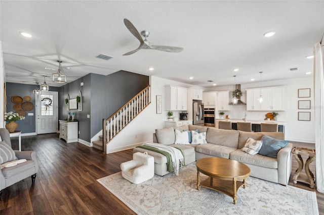 3304 Canna Lily Pl, Clermont, FL 34711 - living room with dark wood-style flooring, stairway, recessed lighting, and ceiling fan