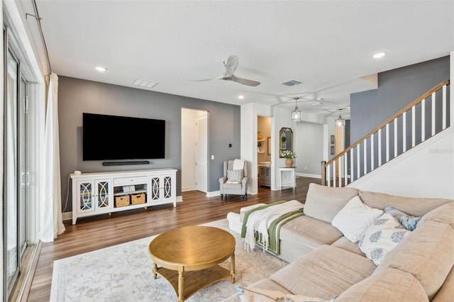 3304 Canna Lily Pl, Clermont, FL 34711 - living area with ceiling fan, wood finished floors, stairway, and recessed lighting
