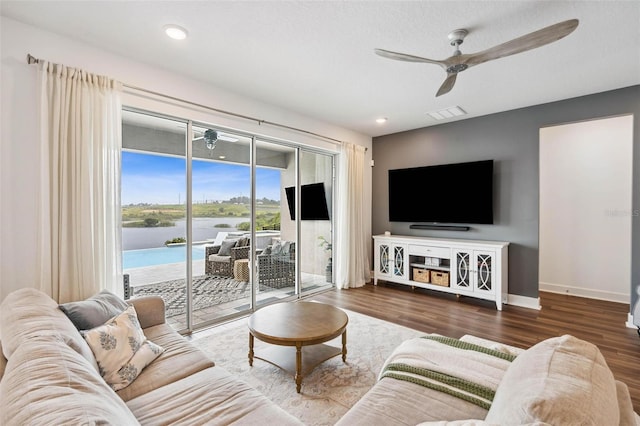 3304 Canna Lily Pl, Clermont, FL 34711 - living area with ceiling fan and wood finished floors