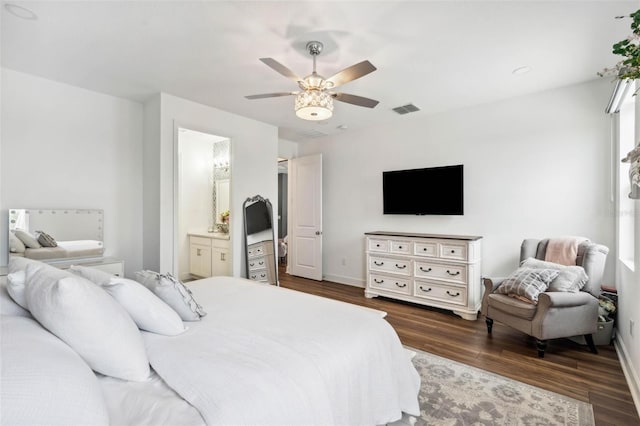 3304 Canna Lily Pl, Clermont, FL 34711 - bedroom with dark wood finished floors, ceiling fan, and ensuite bath