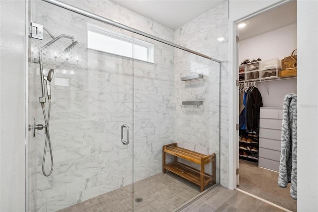 3304 Canna Lily Pl, Clermont, FL 34711 - bathroom with a stall shower and a walk in closet