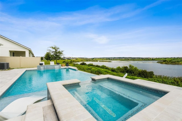 3304 Canna Lily Pl, Clermont, FL 34711 - view of swimming pool featuring a pool with connected hot tub and a water view