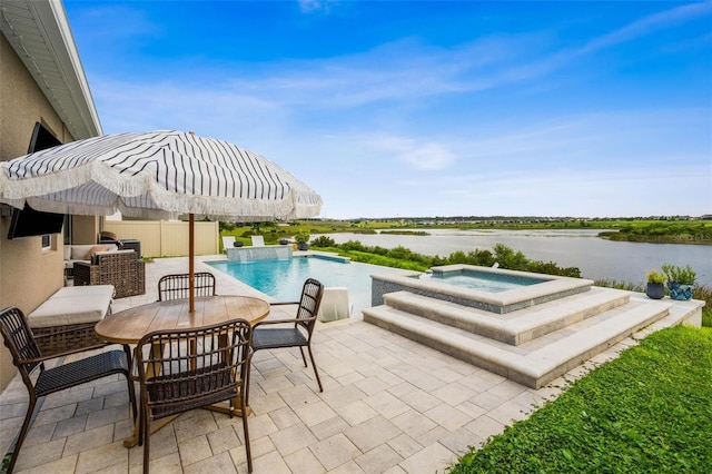 3304 Canna Lily Pl, Clermont, FL 34711 - view of pool with a patio, a water view, and a pool with connected hot tub