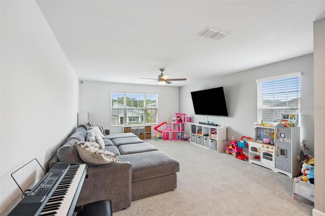 3304 Canna Lily Pl, Clermont, FL 34711 - living room with carpet flooring and ceiling fan