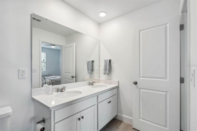 3304 Canna Lily Pl, Clermont, FL 34711 - full bathroom with ensuite bathroom, double vanity, and wood finished floors