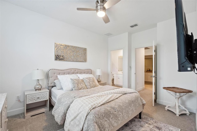 3304 Canna Lily Pl, Clermont, FL 34711 - bedroom featuring light carpet, ensuite bath, and ceiling fan