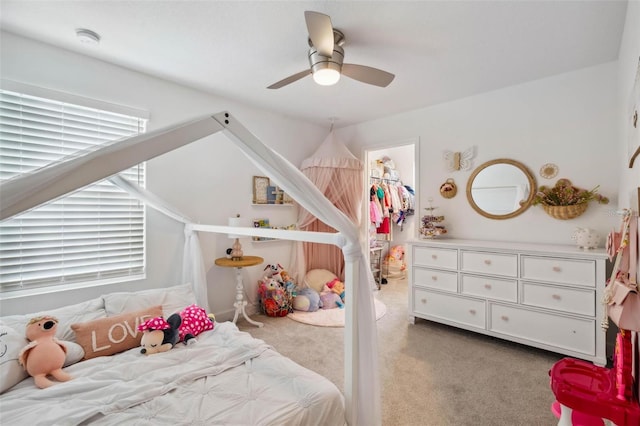 3304 Canna Lily Pl, Clermont, FL 34711 - carpeted bedroom with a spacious closet, ceiling fan, and a closet