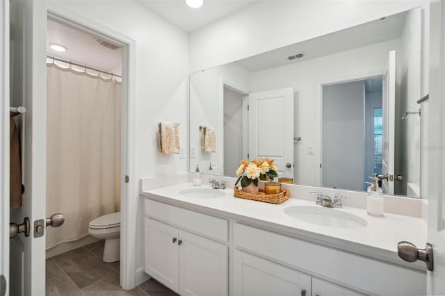3304 Canna Lily Pl, Clermont, FL 34711 - bathroom featuring double vanity, tile patterned floors, and a shower with curtain
