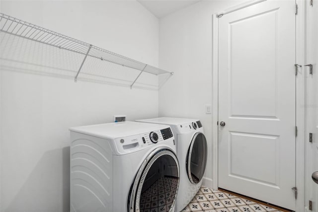 3304 Canna Lily Pl, Clermont, FL 34711 - laundry area featuring washer and clothes dryer and light flooring