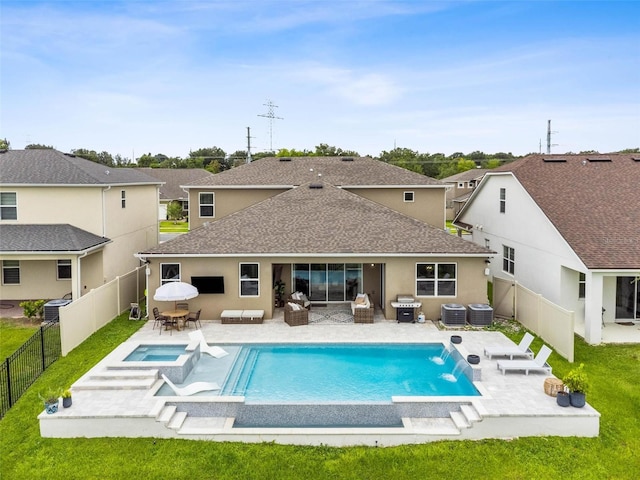 3304 Canna Lily Pl, Clermont, FL 34711 - back of house featuring a fenced backyard, a patio, a shingled roof, and stucco siding