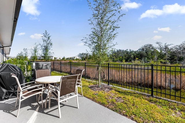 709 Longboat Dr, Davenport, FL 33896 - fenced backyard featuring outdoor dining area and a patio