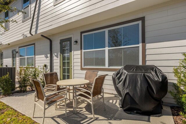 709 Longboat Dr, Davenport, FL 33896 - view of patio / terrace featuring grilling area and outdoor dining area