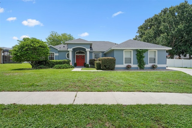 14708 Timucua Pl, Clermont, FL 34711 - view of front of home with stucco siding and roof with shingles
