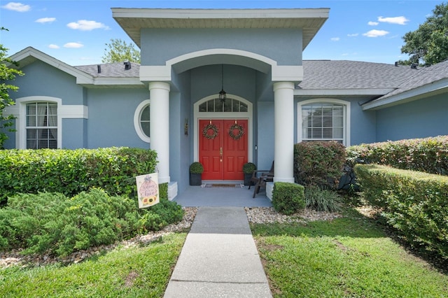 14708 Timucua Pl, Clermont, FL 34711 - property entrance featuring stucco siding and roof with shingles