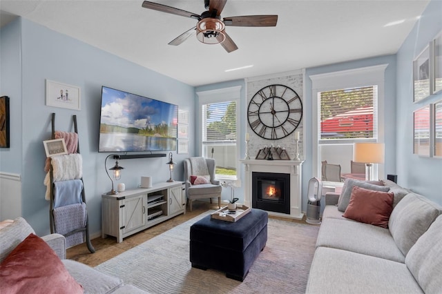 14708 Timucua Pl, Clermont, FL 34711 - living room featuring a ceiling fan, a fireplace, and light tile patterned floors