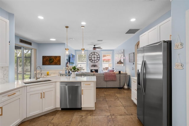 14708 Timucua Pl, Clermont, FL 34711 - kitchen featuring appliances with stainless steel finishes, white cabinetry, ceiling fan, light countertops, and recessed lighting