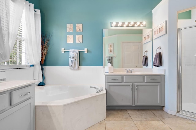 14708 Timucua Pl, Clermont, FL 34711 - full bathroom with vanity, a stall shower, a bath, and tile patterned flooring