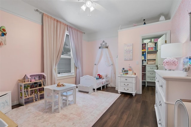 14708 Timucua Pl, Clermont, FL 34711 - bedroom with dark wood-type flooring, a walk in closet, a ceiling fan, and a closet