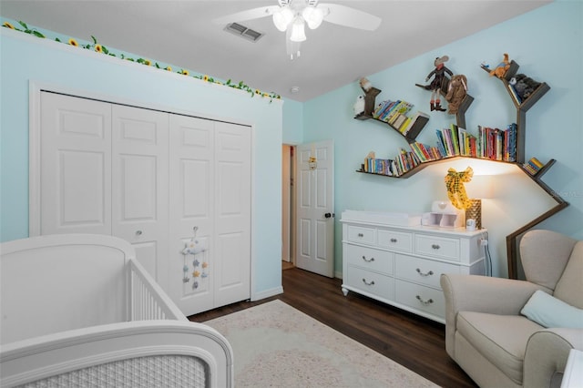 14708 Timucua Pl, Clermont, FL 34711 - bedroom featuring dark wood-style flooring, a closet, and a ceiling fan