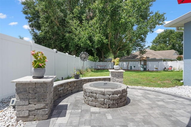 14708 Timucua Pl, Clermont, FL 34711 - fenced backyard with a fire pit and a patio