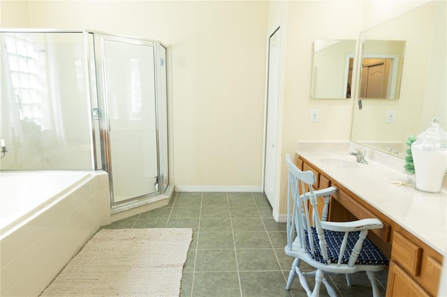 26620 Shoregrass Dr, Wesley Chapel, FL 33544 - full bathroom featuring a stall shower, a garden tub, vanity, and tile patterned flooring