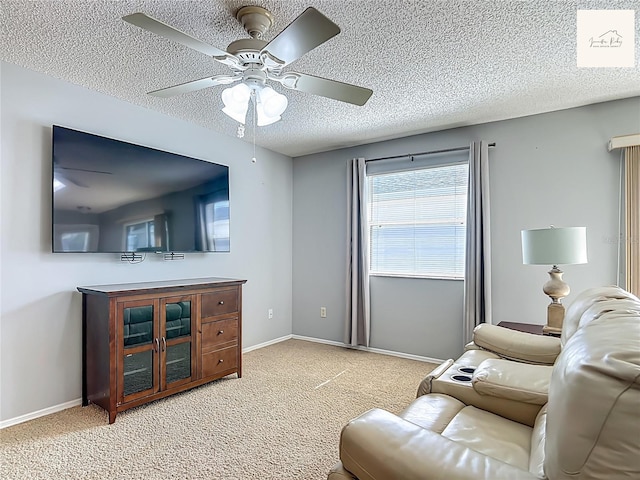 2311 Pine Ridge St, The Villages, FL 32162 - living room with a ceiling fan, a textured ceiling, and carpet