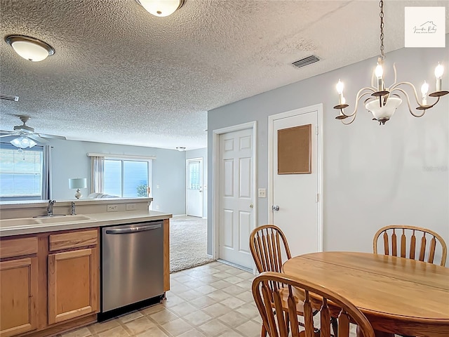 2311 Pine Ridge St, The Villages, FL 32162 - kitchen featuring stainless steel dishwasher, a textured ceiling, light countertops, ceiling fan, and decorative light fixtures
