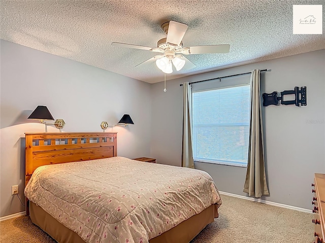 2311 Pine Ridge St, The Villages, FL 32162 - bedroom with light colored carpet, a textured ceiling, and ceiling fan