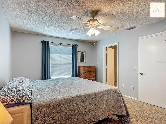 2311 Pine Ridge St, The Villages, FL 32162 - bedroom with carpet flooring, ceiling fan, and a textured ceiling
