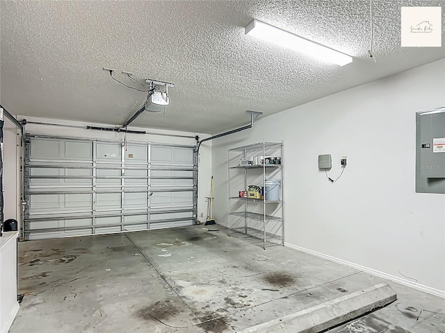 2311 Pine Ridge St, The Villages, FL 32162 - garage featuring electric panel and a garage door opener