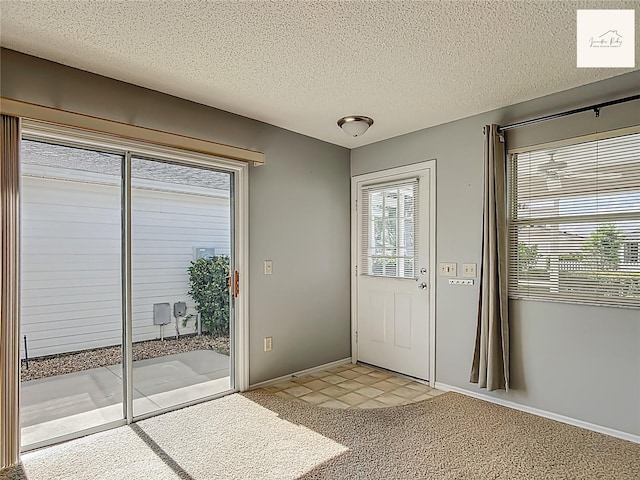 2311 Pine Ridge St, The Villages, FL 32162 - foyer entrance with a textured ceiling and light carpet