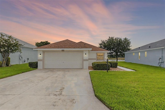 5715 Illumination Ln, Leesburg, FL 34748 - single story home featuring a front yard, stucco siding, driveway, and a garage