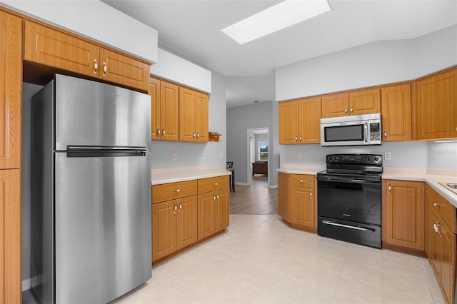 5715 Illumination Ln, Leesburg, FL 34748 - kitchen with stainless steel appliances, light countertops, and brown cabinets