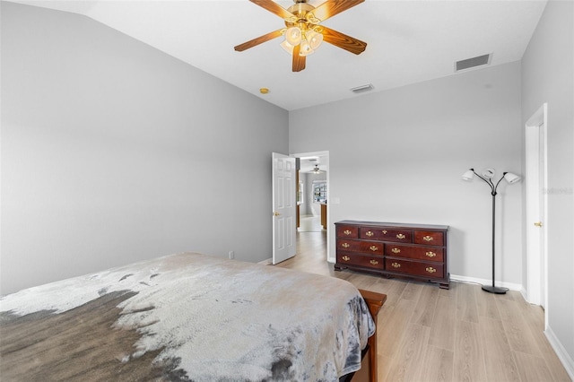 5715 Illumination Ln, Leesburg, FL 34748 - bedroom featuring vaulted ceiling, light wood-style floors, and a ceiling fan