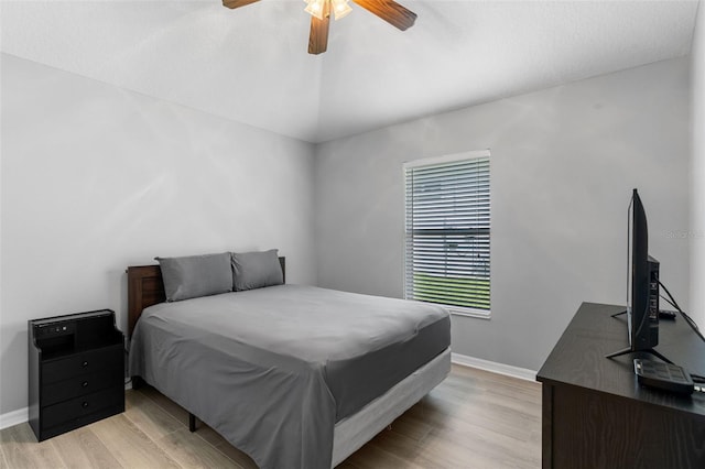 5715 Illumination Ln, Leesburg, FL 34748 - bedroom with light wood-style floors, ceiling fan, and vaulted ceiling