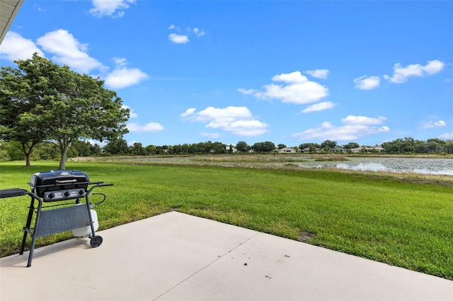 5715 Illumination Ln, Leesburg, FL 34748 - view of patio / terrace with grilling area and a water view