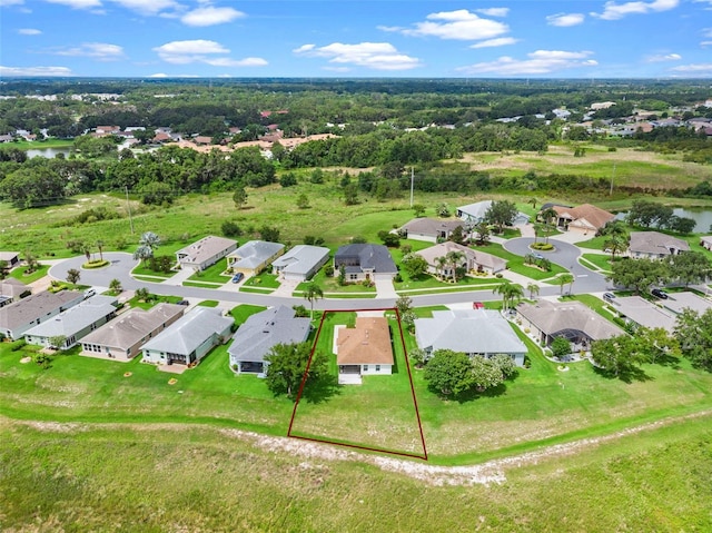 5715 Illumination Ln, Leesburg, FL 34748 - aerial perspective of suburban area with property boundaries highlighted and a nearby body of water