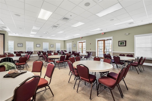 5715 Illumination Ln, Leesburg, FL 34748 - dining space with light colored carpet and a drop ceiling