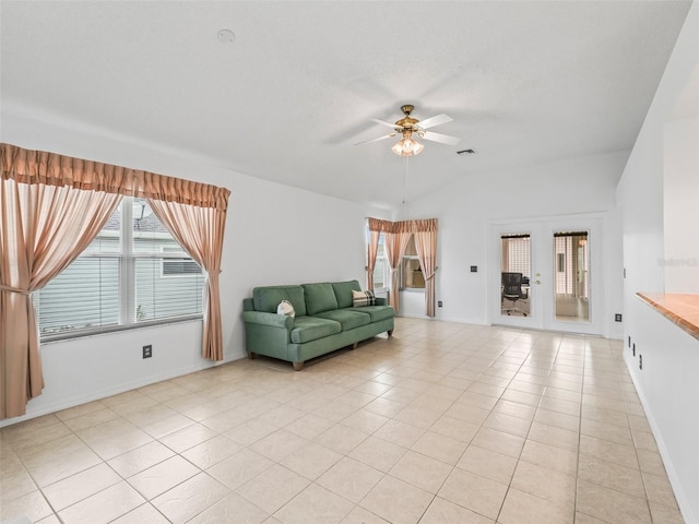 1142 W Boone Ct, The Villages, FL 32159 - living area featuring a ceiling fan, light tile patterned flooring, french doors, and vaulted ceiling