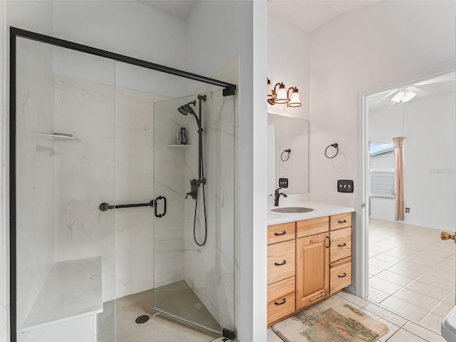 1142 W Boone Ct, The Villages, FL 32159 - bathroom featuring a marble finish shower, vanity, tile patterned flooring, and ceiling fan