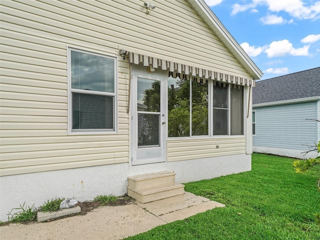 1142 W Boone Ct, The Villages, FL 32159 - property entrance with a yard