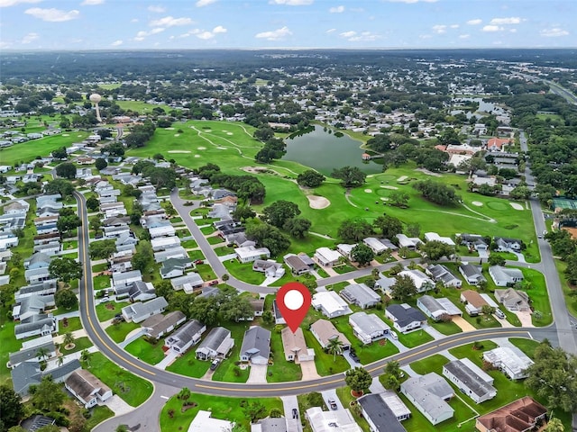 1142 W Boone Ct, The Villages, FL 32159 - aerial overview of property's location featuring a large body of water, nearby suburban area, and a golf course